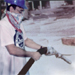 Worker sandblasting without proper protection, by National Institute for Occupational Safety and Health. Worker sandblasting without the use of proper PPE. His face is covered with a bandana instead of a replaceable particulate filter respirator.